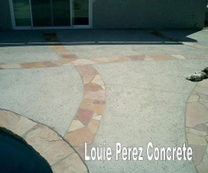 A Concrete Walkway with Patio Tiles in Between